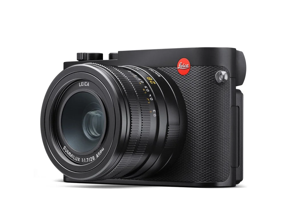 Black Leica Q3 camera with fixed lens on a white background