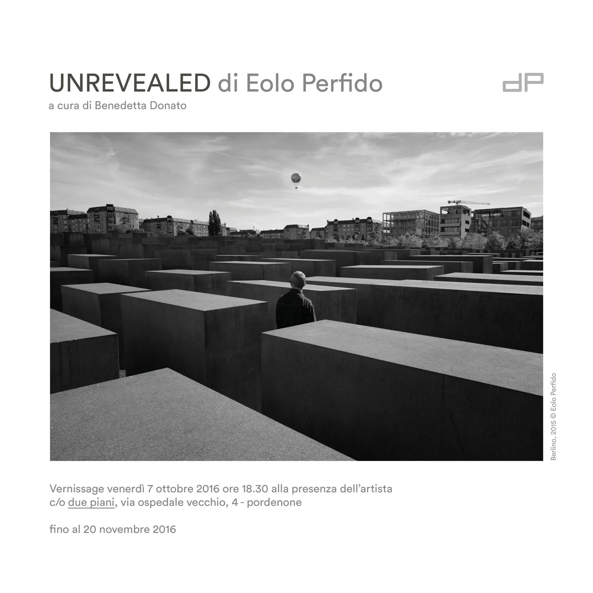Unrevealed exhibition poster featuring a figure among concrete blocks
